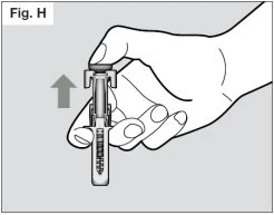 A hand holding an injection pen and pulling upwards