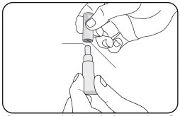 Una mano tiene un piccolo contenitore cilindrico sopra l'applicatore