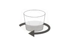Disegno schematico di un bicchiere contenente un liquido con una freccia curva che indica un movimento rotatorio orario