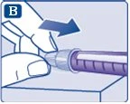 Una mano impugna un dispositivo medico cilindrico e lo spinge verso destra su una superficie piana seguendo la direzione di una freccia blu