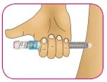 A hand firmly holds a syringe horizontally to inject liquid through the skin
