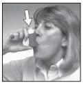 A woman holding a vial close to her mouth to inhale the medication, indicated by a white arrow pointing toward the device