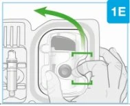 A hand holding a white medical device with a curved green arrow indicating a leftward rotational movement to