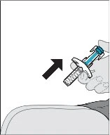 A hand holding a syringe with a needle