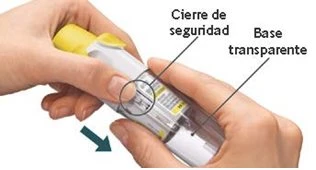 Two hands holding a transparent medical device showing safety lock instructions and a transparent base with a downward-pointing arrow
