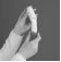 Two gloved hands hold vertically a glass vial containing a dark liquid against a uniform gray background