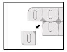 Diagramma che mostra come separare un foglietto con quattro scomparti rettangolari tramite linee tratteggiate e una freccia nera direzionale