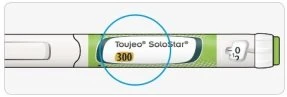 Деталь ручки для ін'єкції Toujeo SoloStar із синім колом, що підкреслює концентрацію 300 одиниць на білому та зеленому тлі