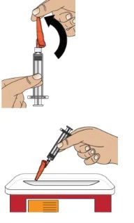 Medical illustration showing one hand removing the red cap from a syringe and another hand gripping it by the