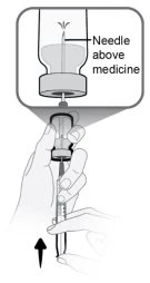 Technical drawing showing a hand holding a syringe to aspirate liquid from a vial with label indication