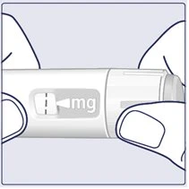 Two hands holding a white cylindrical medical device with a window displaying 'mg' and a dosage indicator
