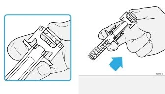 Technical drawing showing two hands holding a medical device for