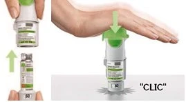Illustration of a white and green medical device being pressed against a flat surface, with a hand pushing down from above