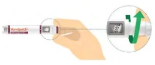 A hand holds a white and red medical device with a magnified inset showing a green arrow indicating a vertical movement toward the