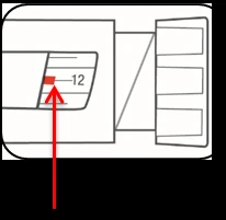 Detail of a medical device with a red arrow indicating the number 12 on a graduated scale, with a red square marker