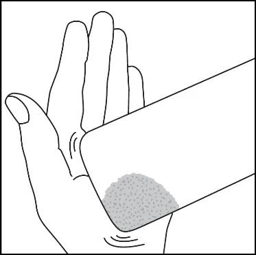 Disegno in bianco e nero di una mano aperta che sostiene un oggetto rettangolare con una parte grigia granulosa sulla superficie inferiore