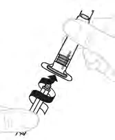 A hand holding a syringe while