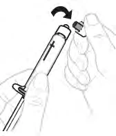 A hand holding an injection pen while