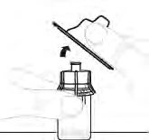 A hand holding a vial while