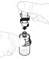 A hand holding a vial and