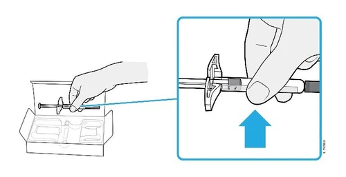 A hand extracts a syringe from an open box and a blue arrow indicates the