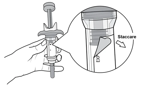 A hand gripping a cylindrical medical device with an inset showing the upper part labeled 'detach' and an arrow