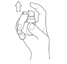 A hand holds a spray bottle with the