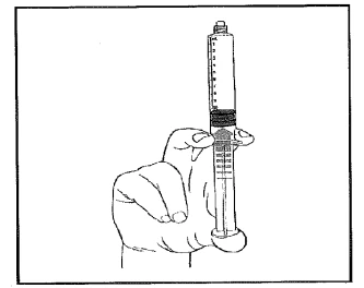 A hand holds a syringe vertically, with the graduated barrel and plunger partially inserted, for drug administration