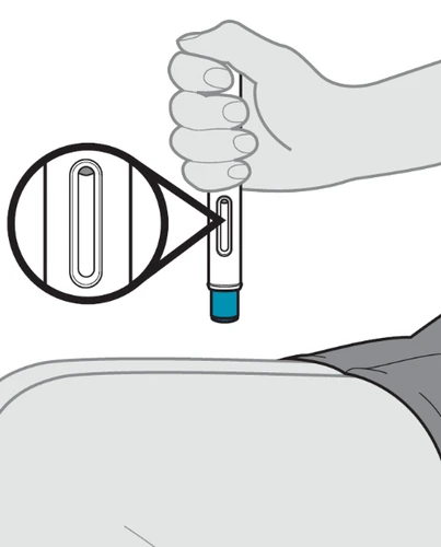A hand holds an injection pen above a thigh with a magnification showing the transparent viewing window