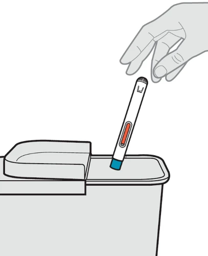 A hand inserts a white pen-shaped medical device with red and blue details into a medical waste disposal container