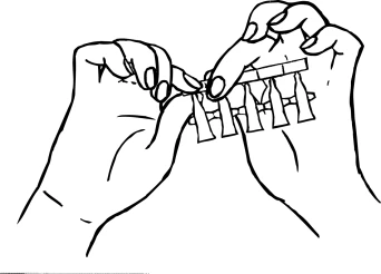 Two hands separating a single dose from a medication blister pack by pressing on the ends of the packaging