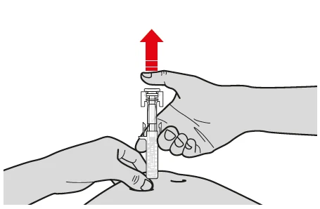 A hand pressing a medical device against the skin while the