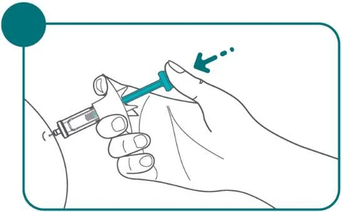 A hand holding a syringe ready for use