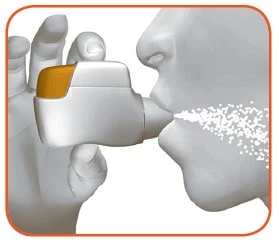 A hand holding a white and orange inhaler near a person's mouth exhaling a cloud of white particles