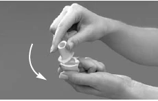 Two hands rotate a white cap of a medical device following the direction indicated by a white curved arrow