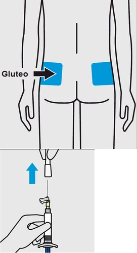 Diagram ciała ludzkiego z niebieskimi obszarami na pośladkach oraz szczegółowym widokiem ręki trzymającej strzykawkę z igłą skierowaną ku skórze