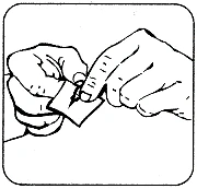 Two hands carefully grasping and tearing open a small wrapper or medication pouch