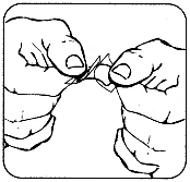Two hands gently pulling apart a small capsule or flat medical device along a central break line