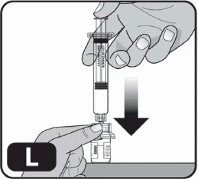 A hand holding a loaded syringe and inserting it vertically into a glass vial held by the