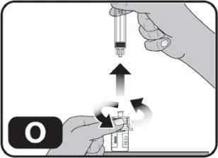A hand holding a vial while the