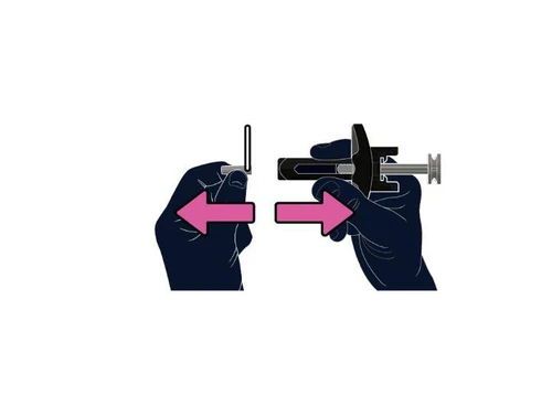 Two hands moving a medical device horizontally, indicated by two pink arrows pointing in opposite directions