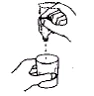 A hand pouring liquid from a vial into a glass held by another hand