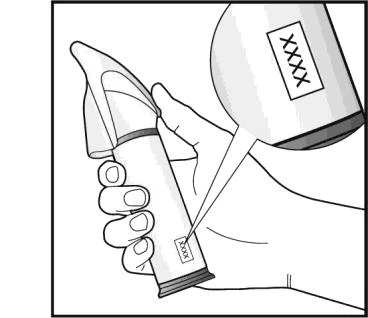 A hand holds a cylindrical medical device with a