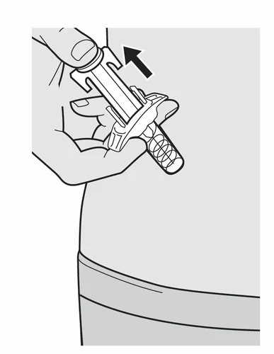 A hand holds a syringe-shaped medical device with a