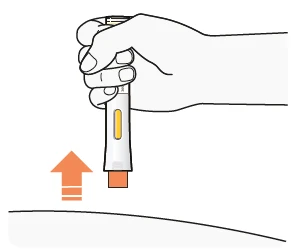 A hand holds a white and orange injectable pen being pressed vertically downward onto a curved surface with an orange arrow