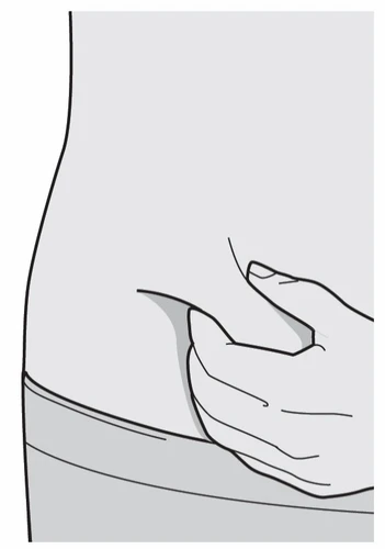 A hand pinching the skin of the