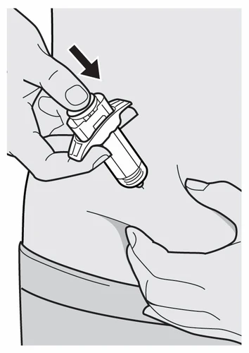 A hand pressing a cylindrical medical device against the