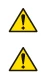 Two identical warning symbols consisting of a yellow triangle with black border and a black exclamation mark at the center on a white background