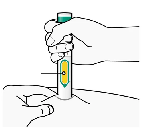 A hand holding a white and green injectable pen placed on the skin of the