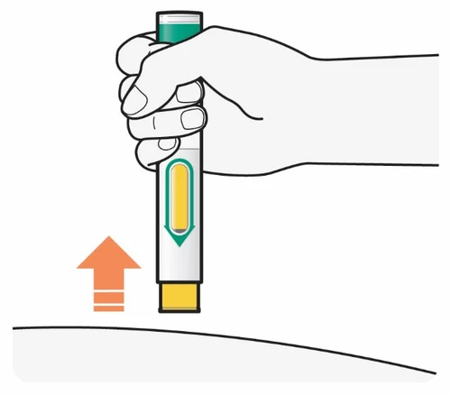 A hand holding a vertical injectable pen above a surface with an orange arrow pointing downward